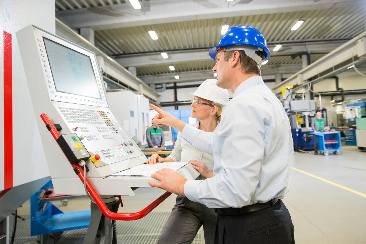 Manager And Engineer Programming A CNC