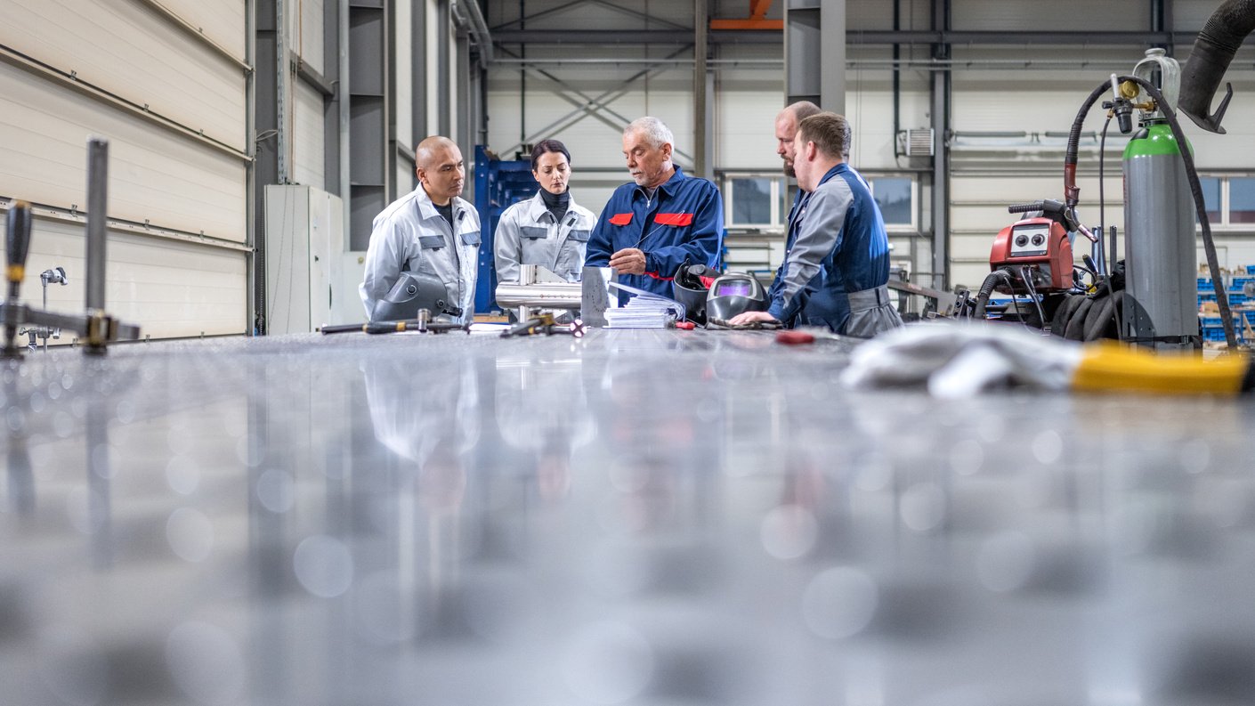 Workers discussing in factory